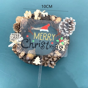 Detail of 10cm Merry Christmas acrylic cake topper with reindeer antlers and hat decor