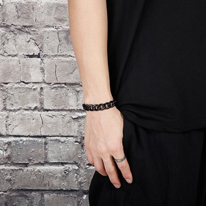 Close-up of a black cuban link bracelet for men with metallic finish in streetwear style