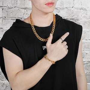 Hip hop street style gold chunky Cuban chain necklace and bracelet set on male model