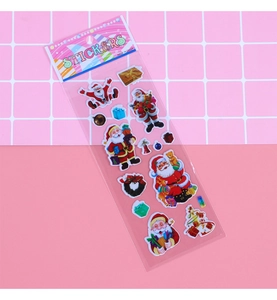 Detailed view of colorful 3D Santa Claus puffy stickers with festive holiday patterns