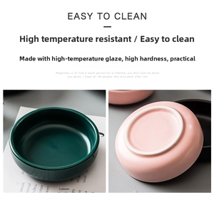 Detail of pink and dark green ceramic seasoning dishes with smooth heat-resistant glaze