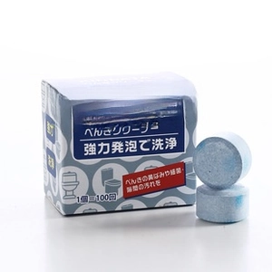 Detail of blue toilet cleaning tablet with compact box showing 100 uses longevity