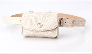 Detail of beige woven belt bag featuring gold twist lock and adjustable metal buckle