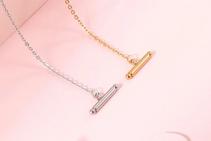 Detail shot of elegant gold and silver chain necklaces with toggle OT clasp closure