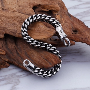 Men's titanium steel woven chain bracelet with silver and black industrial texture