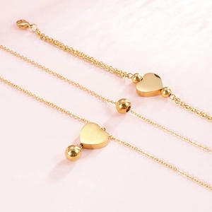 Ensemble de bracelets cœur en acier inoxydable plaqué or 18K sur fond rose