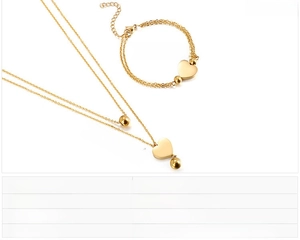Guide des tailles détaillant les mesures du collier et du bracelet à double cœur doré
