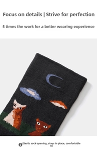 Detail of high-elasticity dark grey cotton sock cuff featuring embroidered cats and moon