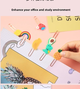 Detailed view of creative metal bookmarks with colorful cartoon strawberry and rainbow toppers