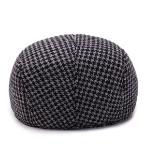 Classic houndstooth flat cap for men in thick black and grey wool fabric, front view