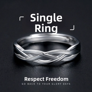 Macro detail of silver woven ring featuring vintage Sanskrit hollowed texture and open band