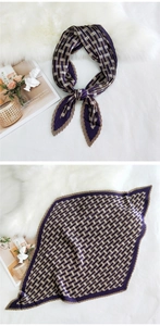 Detail of pleated square scarf with purple geometric pattern on white plush backdrop