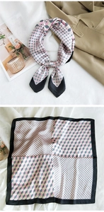 Detail of elegant silk square scarf featuring geometric cube and polka dot patterns