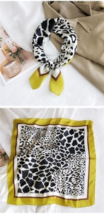 Detail of silk square scarf featuring mixed leopard print and mustard yellow accents