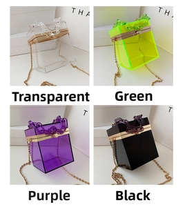 Macro view of acrylic box clutches in transparent, green, purple and black colors