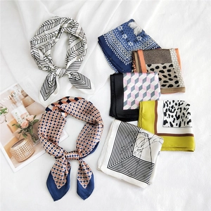 Elegant silk-like square scarves in various colors and patterns for versatile neck styling