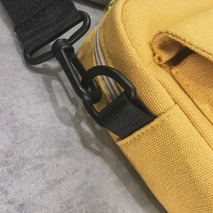 Japanese style yellow canvas crossbody bag with black nylon strap and durable buckle