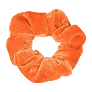 Detailed view of the orange velvet scrunchie, soft hair tie for ponytails and daily styling.