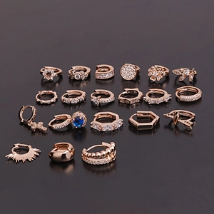 Set of 16 rose gold cartilage earrings featuring zircon flowers, stars and geometric designs