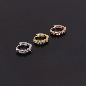 Three mini zircon cartilage hoop earrings in silver, gold, and rose gold finishes