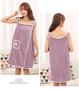Detail of purple coral fleece wearable bath towel wrap with white trim and shoulder straps