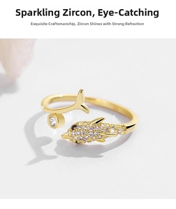Macro shot of dolphin ring with sparkling zircons and detailed 18k gold plating finish