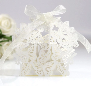 Detail of laser-cut butterfly and heart pattern on white wedding favor gift box