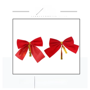 Detail of red velvet Christmas bows with gold twist ties and flexible wire backing