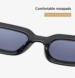 Detail view of comfortable integrated nose pads on black punk rectangle sunglasses