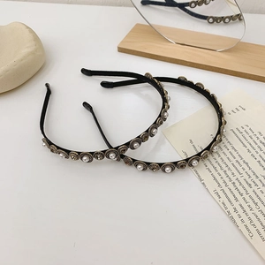 Detailed view of Baroque pearl and crystal headbands in elegant French vintage style
