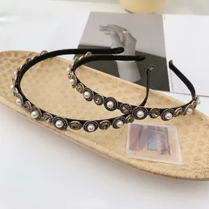 Baroque style thin headband with white pearls and brown crystals in vintage gold settings