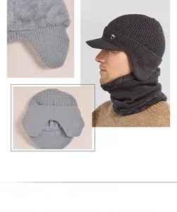 Close-up of winter knitted hat and neck warmer with thick fleece lining and shield logo