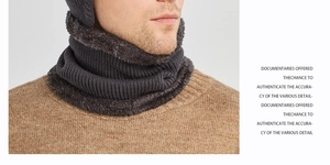 Close-up of dark grey winter knitted hat with thick fleece lining and ribbed texture