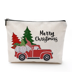 Merry Christmas canvas makeup bag with festive red truck and Santa print on white background