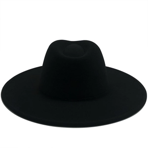 Minimalist black wide brim wool fedora hat for women with a structured crown and flat brim