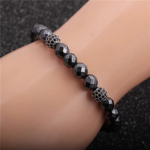 Faceted hematite beaded bracelet for men featuring black micro-pave zircon spheres on wrist