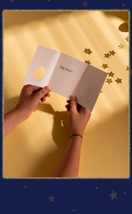 Detailed tri-fold Christmas card featuring a circular cutout and festive greetings