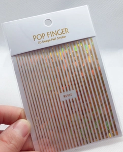 Close-up of golden 3D holographic stripe nail sticker WG430 by POP FINGER for nail art