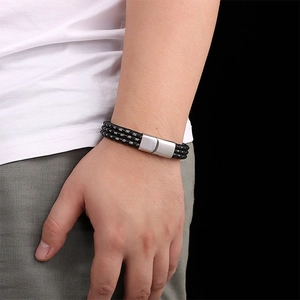 Men's minimalist black woven leather bracelet with polished stainless steel magnetic clasp