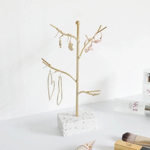 Nordic gold tree jewelry stand with white terrazzo base for earrings and necklaces