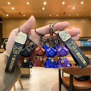French Bulldog keychain with geometric facet design and leather strap in four colors