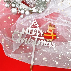Detail of silver mirror acrylic Merry Christmas cake topper with cute cartoon reindeer