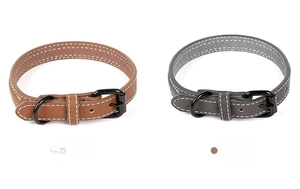 Detail view of brown and grey PU leather pet collars with durable black metal buckles