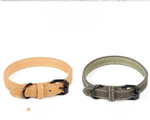 Detail of khaki and olive green PU leather pet collars with black matte metal buckles