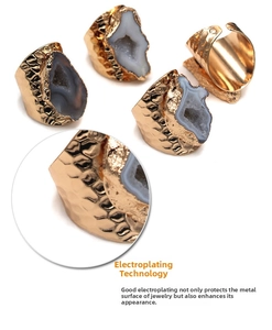 Detail of gold plated irregular natural agate geode ring with vintage hammered metal texture