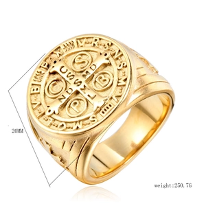 Detail of 20mm golden Saint Benedict medal ring in polished stainless steel