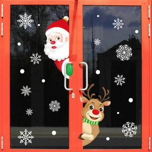 Christmas window static stickers with Santa, reindeer and snowflakes on a glass door