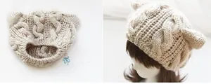 Detail of beige cable-knit beanie with cat ears on a mannequin and flat lay view