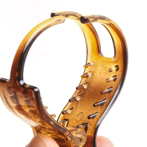 Classic tortoiseshell hair claw clip with durable spring mechanism for bun hairstyles