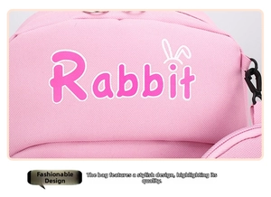 Close-up of pink school bag featuring rabbit ears decoration and smooth zipper detail